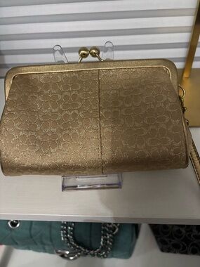 Coach Kisslock Clutch gold metallic signature